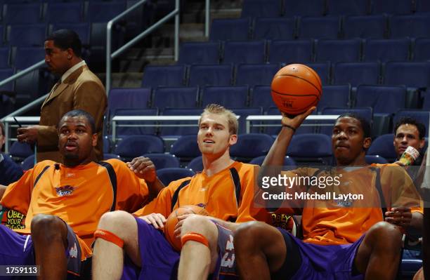 Alton Ford , Jake Voskuhl and Joe Johnson of the Phoenix Suns look on during warm-ups prior to the start of the game against the Washington Wizards...
