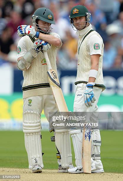 Australia's Chris Rogers alongside Australia's Michael Clarke appeals against the umpire's caught-behind decision during play on the second day of...