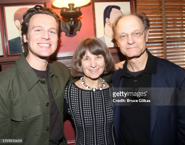 Jonathan Groff, Barbara Pierce and brother David Hyde Pierce pose at a caricature portrait unveiling for broadway orchestrator Jonathan Tunick at...
