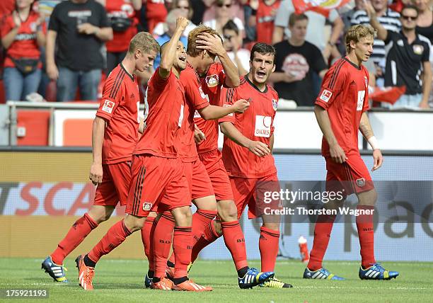 Players of Leverkusen celebrates after Sidney Sam is scoring his teams third goal during the Bundesliga match between Bayer 04 Leverkusen and SC...