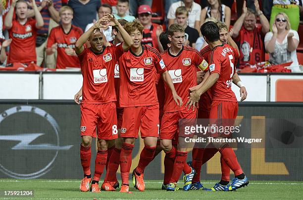 Players of Leverkusen celebrates after Sidney Sam is scoring his teams third goal during the Bundesliga match between Bayer 04 Leverkusen and SC...