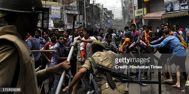 Police Personnel trying to stop protestors during a protest over riots in Kishtwar town on August 10, 2013 in Jammu, India. A town in the south of...