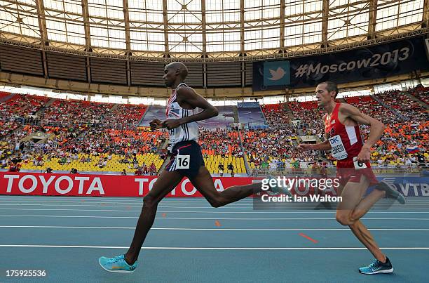 Mo Farah of Great Britain and Dathan Ritzenhein of the United States compete in the Men's 10000 metres final during Day One of the 14th IAAF World...