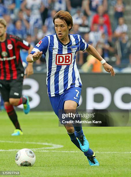 Hajime Hosogai of Berlin runs with the ball during the Bundesliga match between Hertha BSC Berlin and Eintracht Frankfurt at Olympiastadion on August...