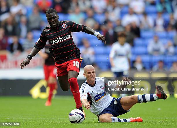 Marc Tierney of Bolton Wanderers in action with Royston Drenthe of Reading during the Sky Bet Championship match between Bolton Wanderers and Reading...