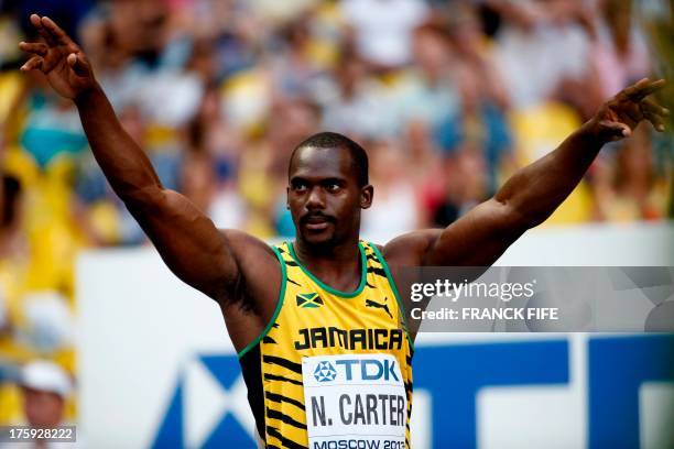 Jamaica's Nesta Carter wins a men's 100 metres qualifier at the 2013 IAAF World Championships at the Luzhniki stadium in Moscow on August 10, 2013....