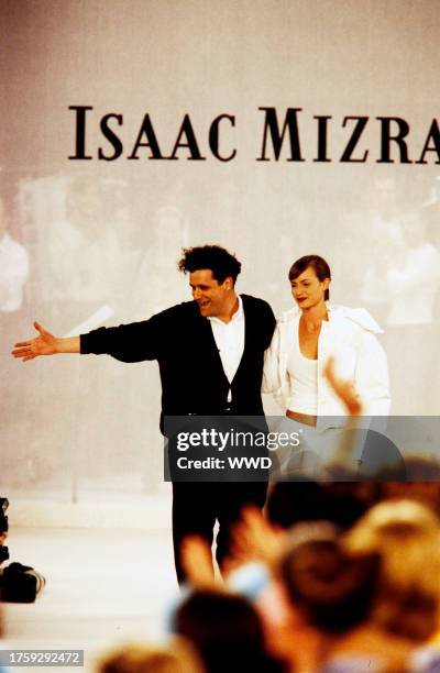 Designer Isaac Mizrahi and model Amber Valletta walk down the runway during fashion show finale. ; The filming of this fashion show is part of the...