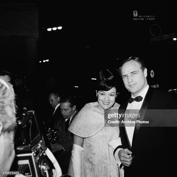 American actor Marlon Brando with his wife, actress Movita Castaneda, at the premiere of Brando's film 'The Mutiny on the Bounty', USA, November 1962.