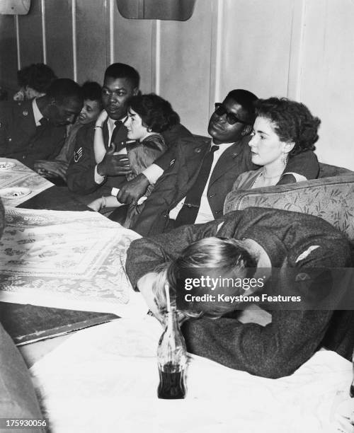 Couples take a break from dancing at the 'Club Americana', a Saturday night jazz club open from midnight until 7 a.m., London, 25th November 1955.