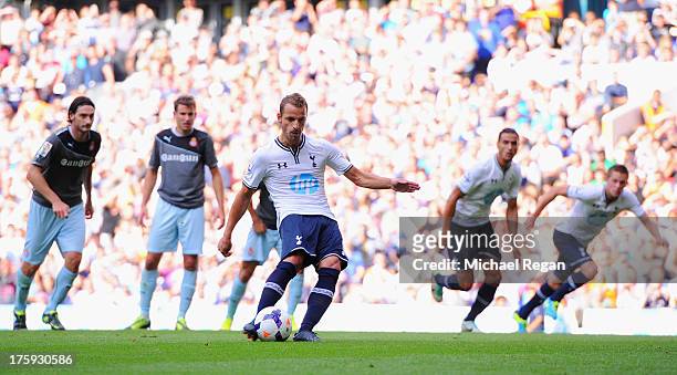 Roberto Soldado of Tottenham scores a penalty to make it 1-0 during a pre season friendly match between Tottenham Hotspur and Espanyol at White Hart...