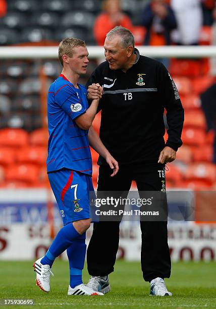 Manager Terry Butcher of Inverness Caledonian Thistle celebrates with William McKay at full time of the Scottish Premier League match between Dundee...