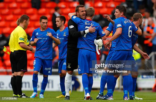 Dean Brill of Inverness Caledonian Thistle celebrates with William McKay at full time of the Scottish Premier League match between Dundee United and...