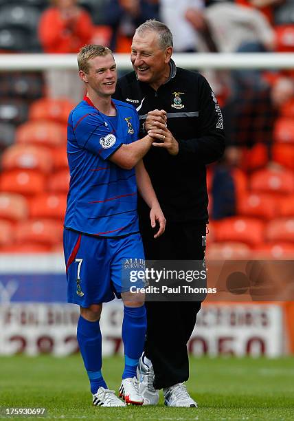 Manager Terry Butcher of Inverness Caledonian Thistle celebrates with William McKay at full time of the Scottish Premier League match between Dundee...