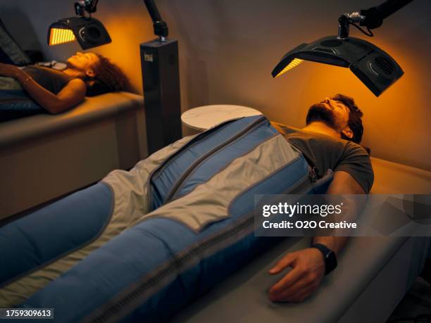 young adult in a biohacking center - biohacking stock pictures, royalty-free photos & images