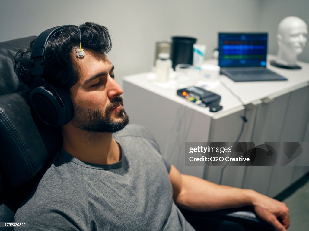 Young Man Receiving Neurofeedback Treatment
