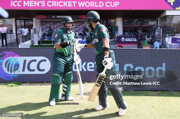 Imam-ul-Haq and Abdullah Shafique of Pakistan make their way out to bat the ICC Men's Cricket World Cup India 2023 between Pakistan and South Africa...