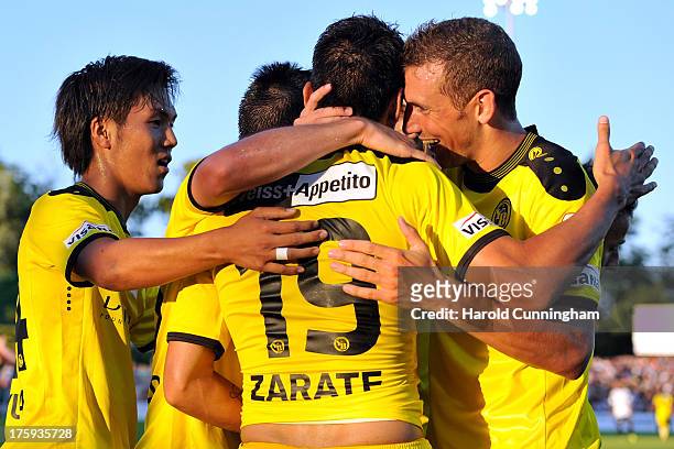 Yuya Kubo celebrates with his team mates the opening goal of Gonzalo Zarate of BSC Young Boys in action during the Swiss Super League match between...