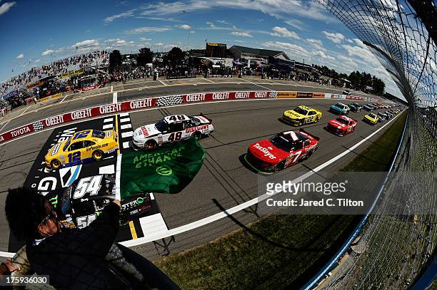 Sam Hornish Jr., driver of the Penske Truck Rental Ford, leads the field at the start of the race during the NASCAR Nationwide Series Zippo 200 at...
