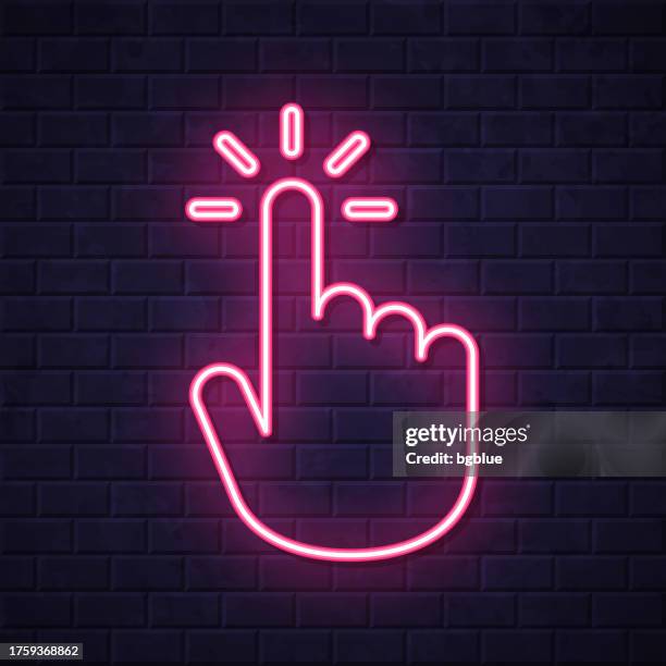 click with hand cursor. glowing neon icon on brick wall background - touch screen wall stock illustrations