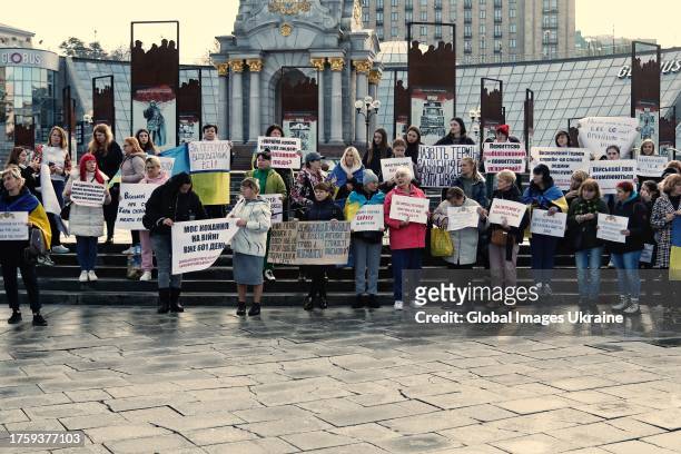 Rally participants with Ukrainian flags and posters calling for the adoption of the law on demobilization stand on the city's center on October 27,...