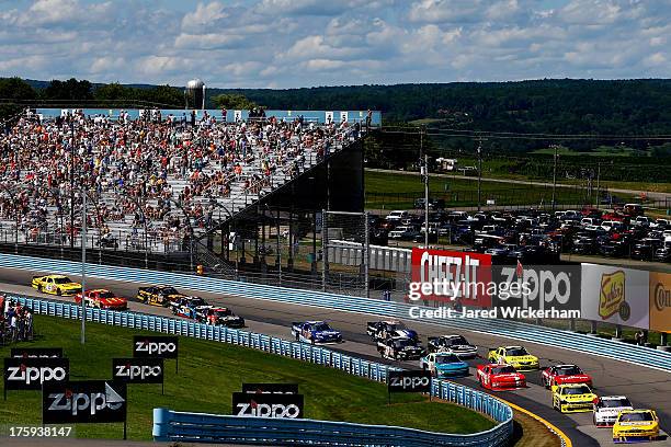 Sam Hornish Jr., driver of the Penske Truck Rental Ford, leads a pack of cars during the NASCAR Nationwide Series Zippo 200 at Watkins Glen...