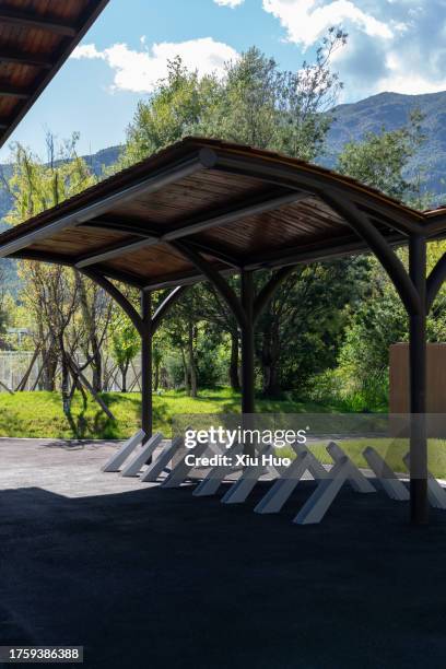 bicycle parking shed in the park - parking log stock pictures, royalty-free photos & images