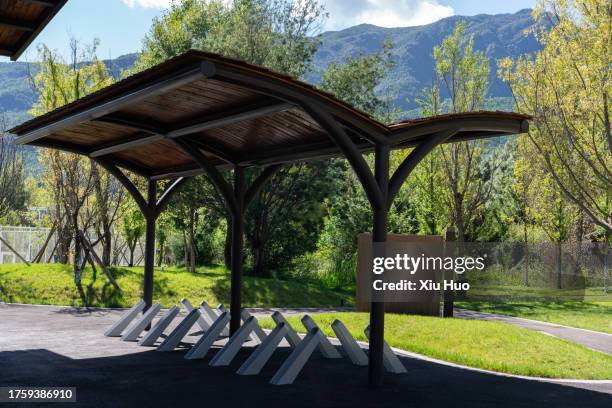 bicycle parking shed in the park - parking log stock pictures, royalty-free photos & images