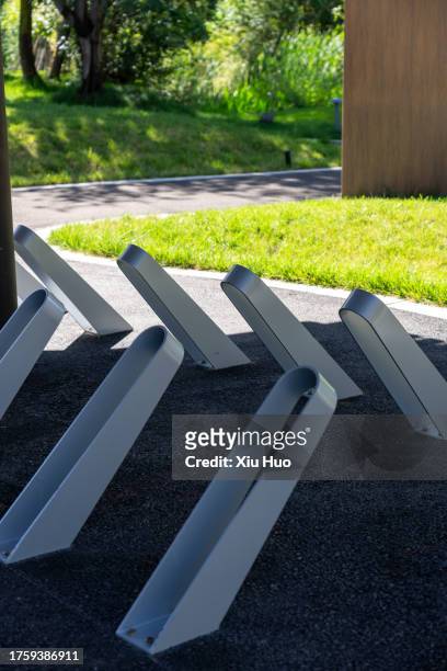 bicycle parking shed in the park - parking log stock pictures, royalty-free photos & images