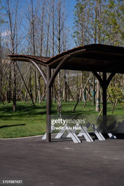 bicycle parking shed in the park - parking log stock pictures, royalty-free photos & images