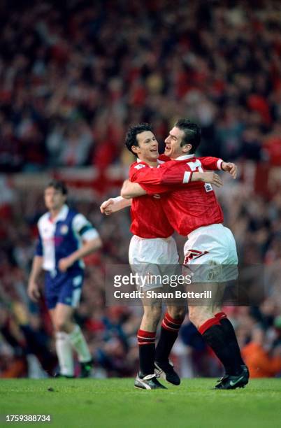 Ryan Giggs celebrates his goal with Eric Cantona during the Premier League match against Blackburn Rovers on May 3rd, 1993 in Manchester, England.