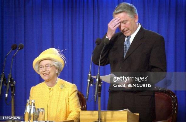 Queen Elizabeth II laughs, 28 May 2002, at a special sitting of the Scottish Parliament, as part of the continuing Golden Jubilee celebrations, as...