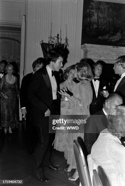 Jamie Auchincloss and Betsy Loomis attend a gala at Rosecliffe, a mansion in Newport, Rhode Island, on August 14, 1977.