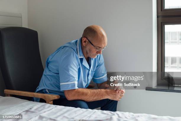 overworked and stressed out - tired healthcare worker stock pictures, royalty-free photos & images