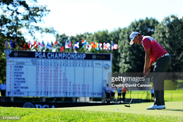 Jonas Blixt of Sweden putts on the 18th green during the third round of the 95th PGA Championship at Oak Hill Country Club on August 10, 2013 in...