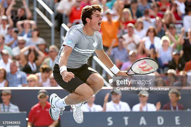 Milos Raonic of Canada celebrates match point against Vasek Pospisil of Canada during the semifinals of the Rogers Cup at Uniprix Stadium on August...