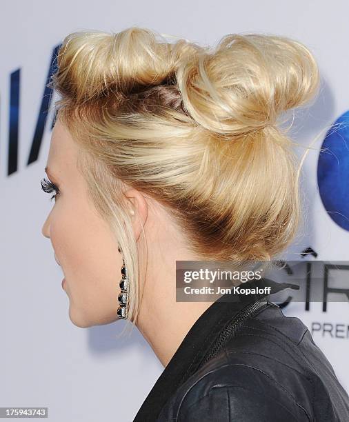 Actress Emily Osment arrives at the Los Angeles Premiere "Paranoia" at DGA Theater on August 8, 2013 in Los Angeles, California.