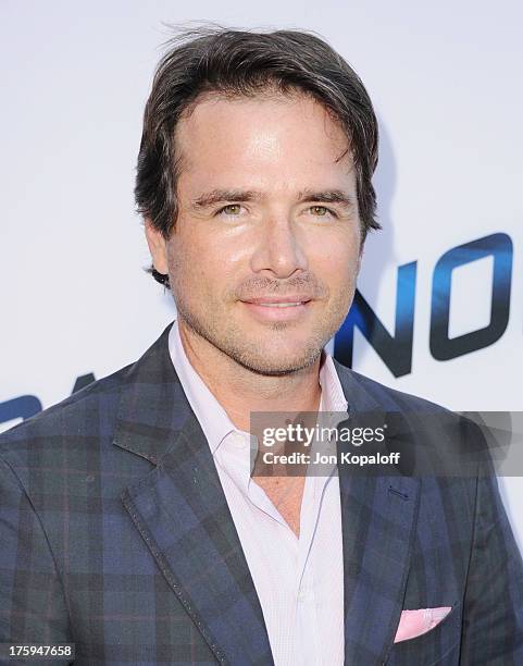 Actor Matthew Settle arrives at the Los Angeles Premiere "Paranoia" at DGA Theater on August 8, 2013 in Los Angeles, California.