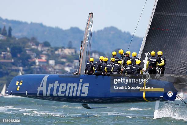 Members of Team Artemis Racing skippered by Iain Percy take practice before the start of race four of the Louis Vuitton Cup semi final on August 10,...