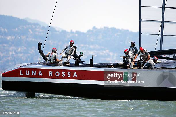 Team Luna Rossa Challenge skippered by Massimiliano Sirena competes against Team Artemis Racing skippered by Iain Percy during race four of the Louis...