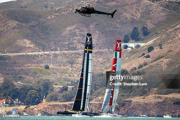 Team Artemis Racing skippered by Iain Percy and Team Luna Rossa Challenge skippered by Massimiliano Sirena take practice before the start of race...