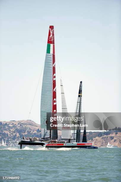 Team Luna Rossa Challenge skippered by Massimiliano Sirena competes against Team Artemis Racing skippered by Iain Percy during race four of the Louis...