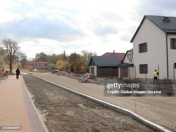 General view of a street during a reconstruction of private housing destroyed by hostilities on October 23, 2023 in Irpin, Ukraine. In Irpin, the...