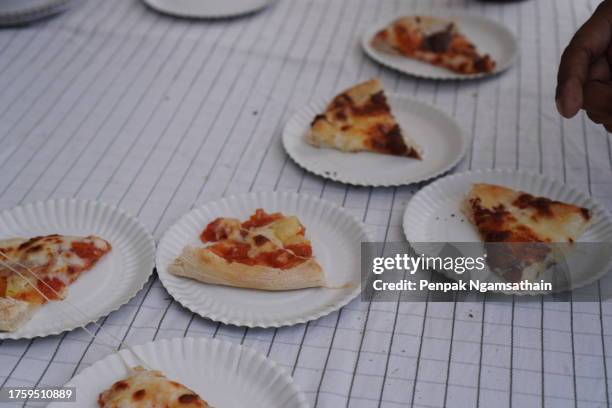 pizza on white paper plate - cheese nips stock pictures, royalty-free photos & images