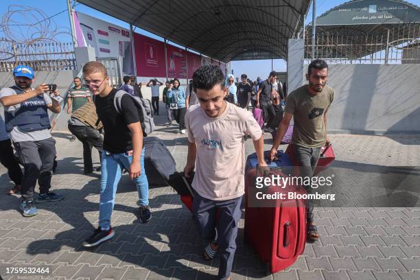 Palestinians with dual citizenship while seeking permission to leave Gaza at the Rafah border crossing into Egypt in Rafah, Gaza, on Wednesday, Nov....