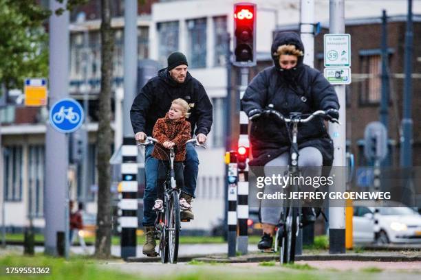 Cyclists brave wind and rain in Rotterdam, on November 2 ahead of the storm Ciaran. In a large part of the Netherlands, code orange applies for heavy...