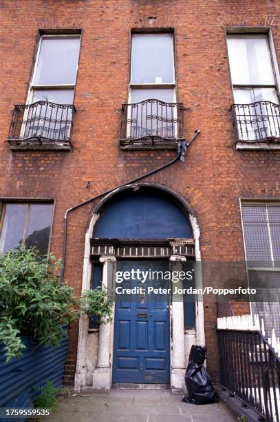 View of the front entrance to a decaying Georgian house on Mountjoy Square, a garden square on the Northside of the city of Dublin, capital of...