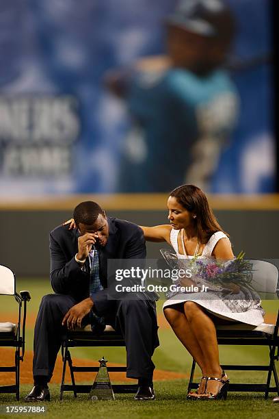 Former Mariners great, Ken Griffey Jr. Is comforted by his wife Melissa during a ceremony inducting him into the Seattle Mariners Hall of Fame prior...