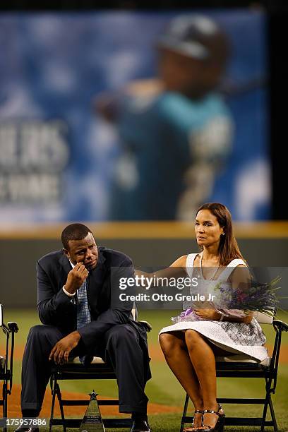 Former Mariners great, Ken Griffey Jr. Is comforted by his wife Melissa during a ceremony inducting him into the Seattle Mariners Hall of Fame prior...