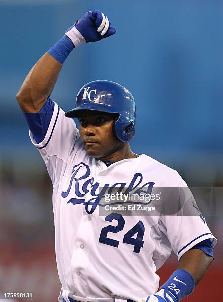 Miguel Tejada of the Kansas City Royals celebrates a RBI single in the fifth inning against the Boston Red Sox at Kauffman Stadium August 2013 in...