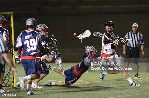 Jordan Macintosh of the Rochester Rattlers shoots behind his back against the Boston Cannons at Harvard Stadium on August 10, 2013 in Cambridge,...